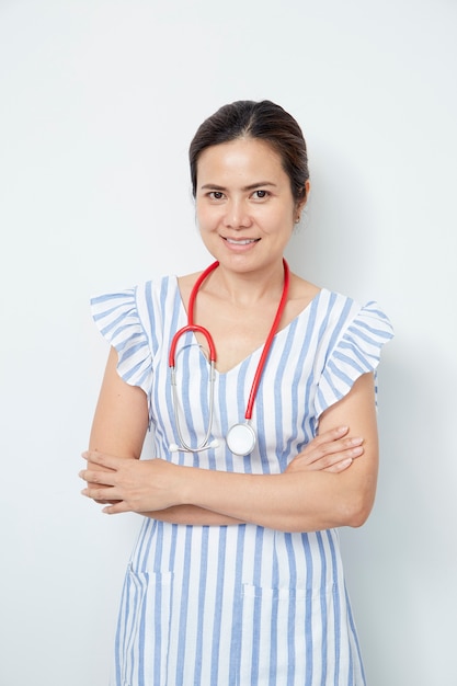 Female doctor nurse with red stethoscope