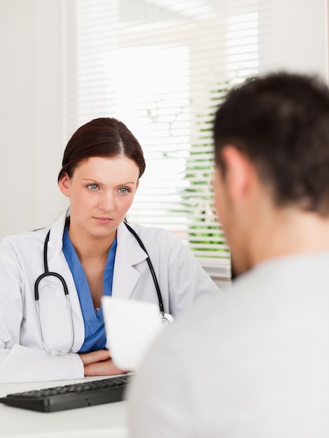 Female doctor and patient with prescription