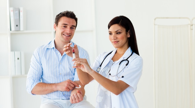 Female doctor preparing an injection