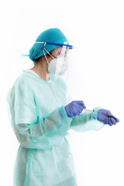 Female doctor preparing vaccine with PPE on white background
