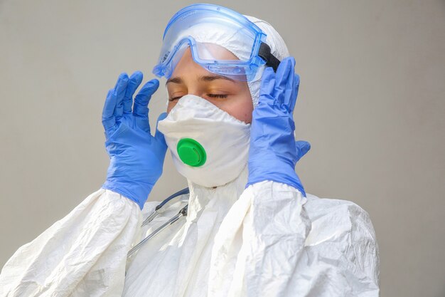 Female doctor in a protective suit