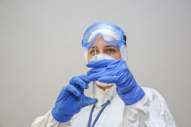 Female doctor in a protective suit