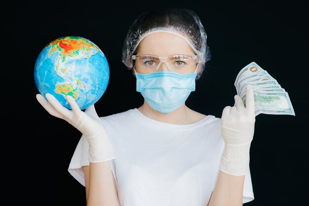 Female doctor in the protective suits and mask