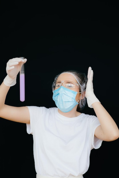 Female doctor in the protective suits and mask