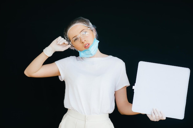 Female doctor in the protective suits and mask