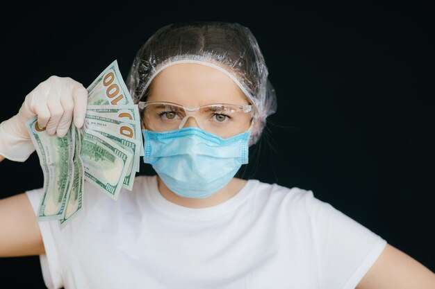 Female doctor in the protective suits and mask