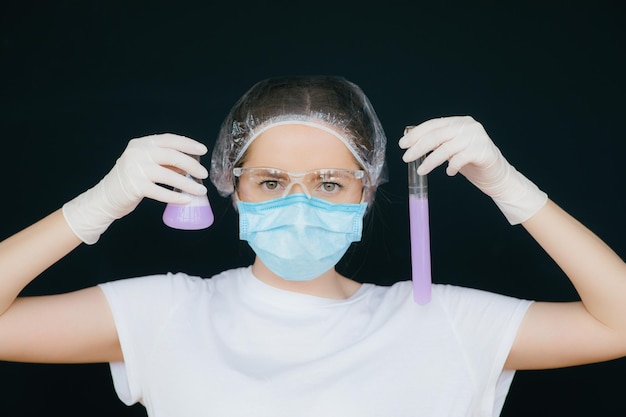 Female doctor in the protective suits and masks