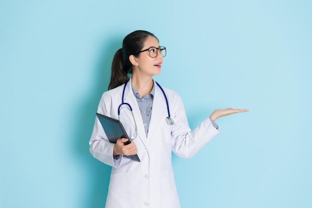 female doctor showing presentation and looking forward friendly with her professional smile.