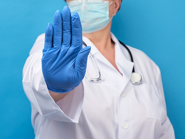 Female doctor shows stop gesture