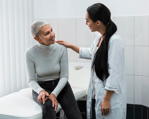 Female doctor talking with patient