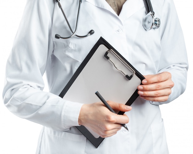 Female doctor in uniform holding clipboard