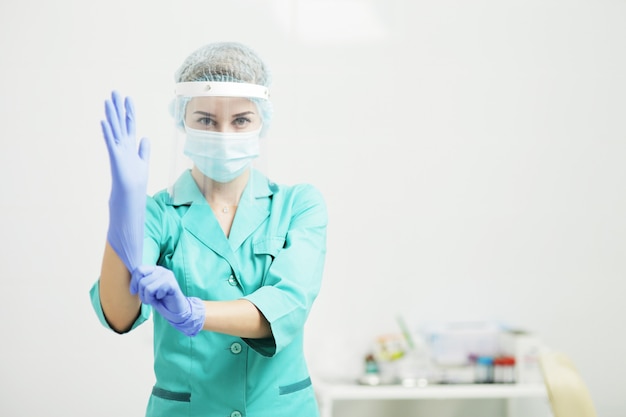 Female doctor in uniform, and medical face mask