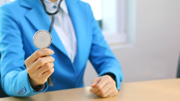 The female doctor using stethoscope.focus of stethoscope