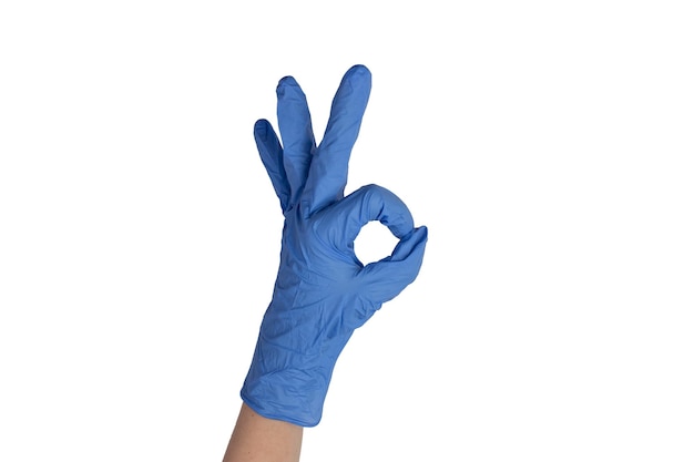 Female doctor wearing blue styryl gloves and showing different hand gestures isolated on white background Health concept Hospital medical care