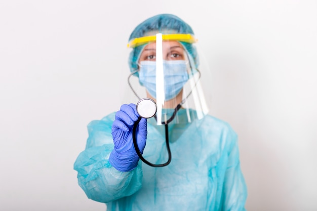 Female doctor wearing PPE protection suite for fighting and stop Spread of Covid-19 with white background and covid-19 outbreak concept