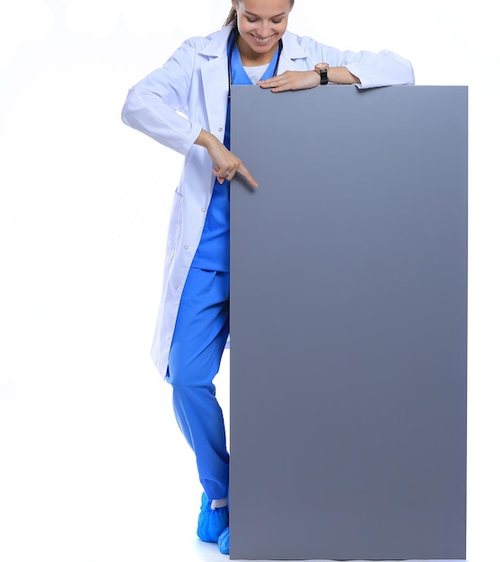 A female doctor with a blank billboard Woman doctor