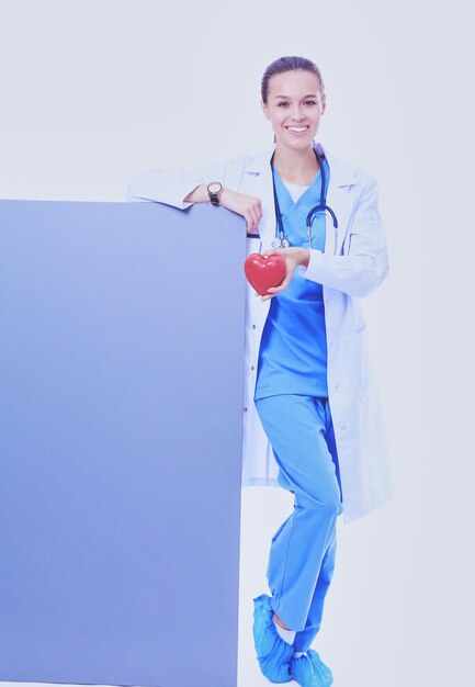 A female doctor with a blank billboard woman doctor