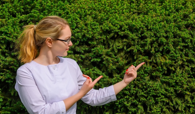 Female doctor with fingers point up