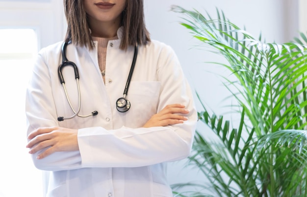 Female doctor with stethoscope and white coat