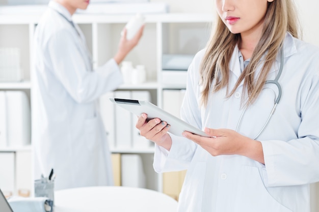 Female doctor with tablet computer