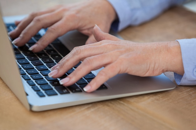 Female doctor working on her laptop