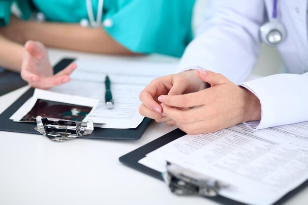 Female doctor  and young surgeon intern in hospital