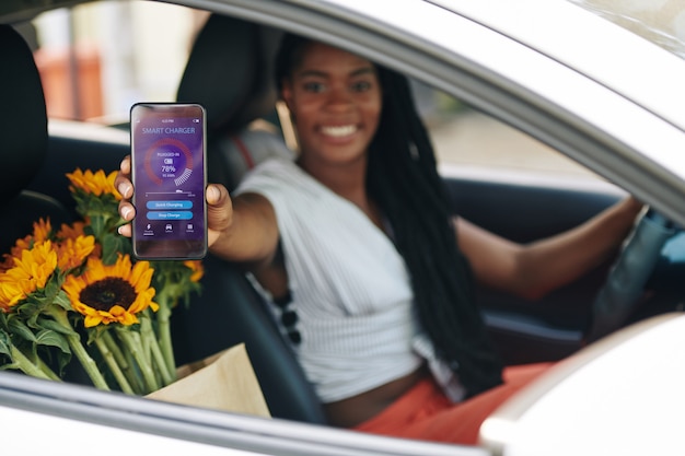 Female driver using car charger