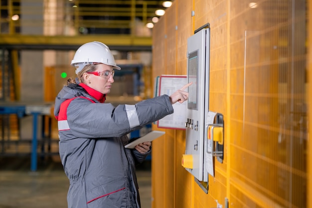 Female Engineer Setting Up Equipment