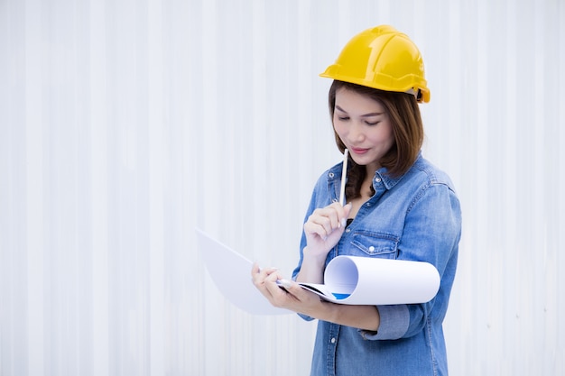 Female engineer working at construction site.