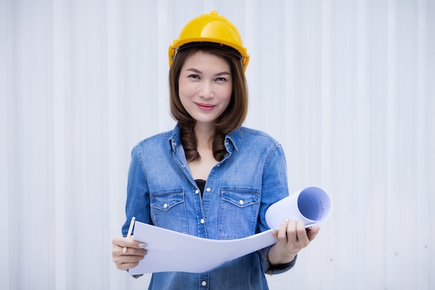 Female engineer working at construction site.