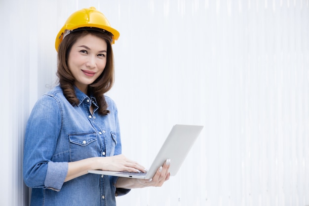 Female engineer working at construction site.