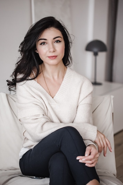 Female entrepreneur sitting in contemporary workplace