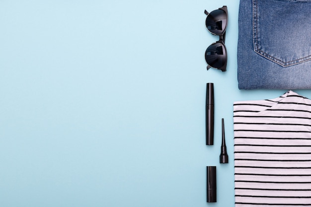 Female everyday casual clothes, jeans, glasses, nail polish and shirt