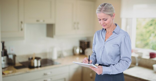 Female executive writing in notepad