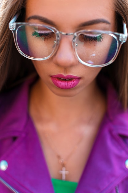 Photo female face with glasses closeup