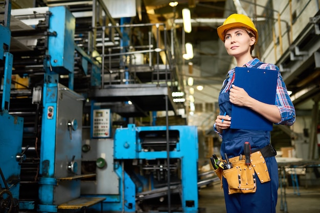 Female Factory Manager Overseeing Production