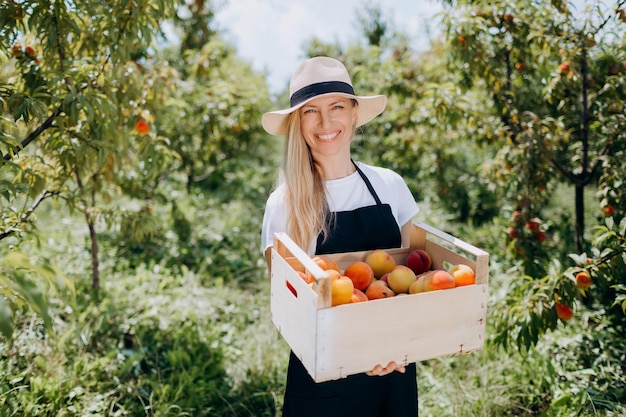 Female farmer with peaches