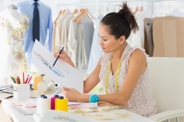 Female fashion designer working on her designs