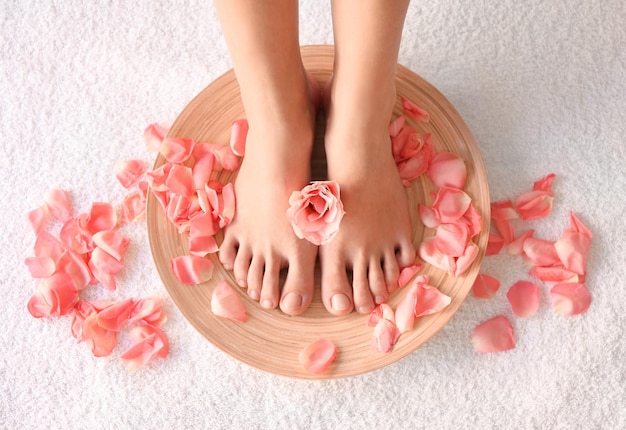 Female feet at spa pedicure procedure