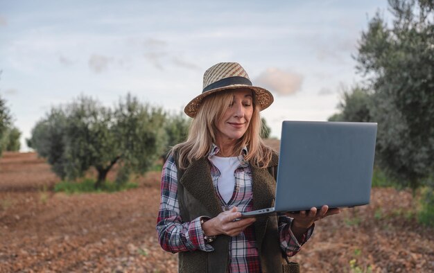 Female field engineer examining agricultural plantation Integration agronomist women in the field