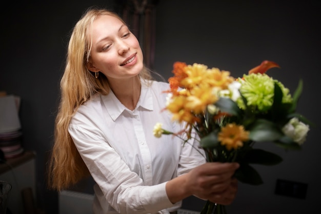 Female florist holding a beautiful bouquet