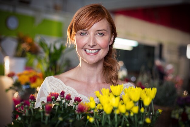 Female florist holding flower bouquet