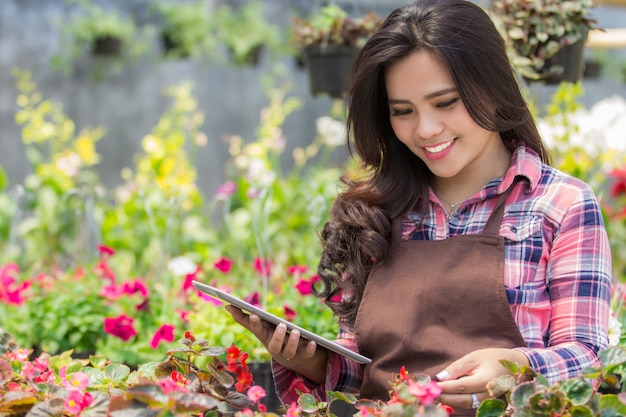 Female florist using tablet