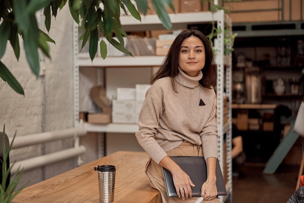 Female freelancer taking break in workspace