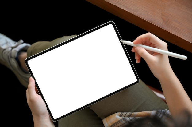 Female freelancer using digital tablet touchpad for design her works Tablet white screen mockup