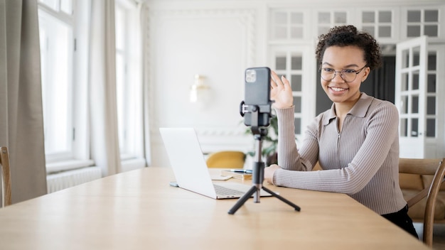 Female freelancer video communication online uses phone