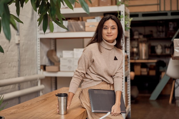 Female freelancer with coffee and netbook