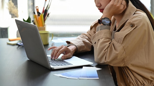 Female freelancer working with laptop computer.