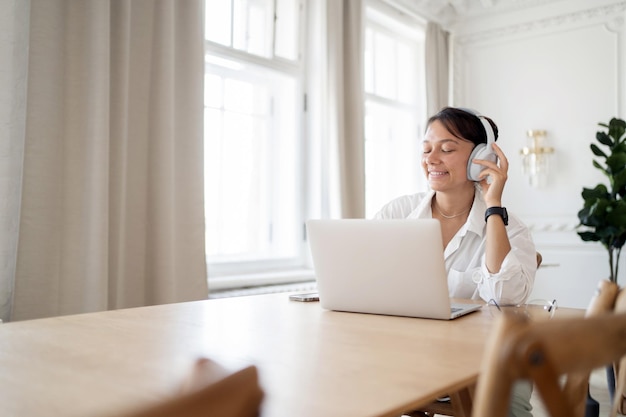 A female freelancer works at home using a laptop