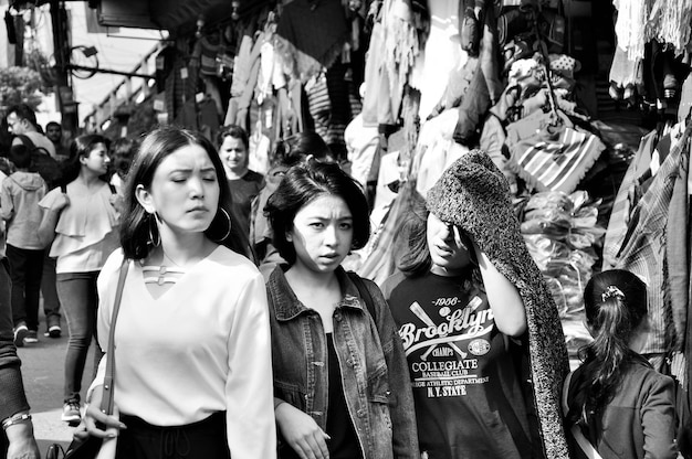 Female friends standing in market